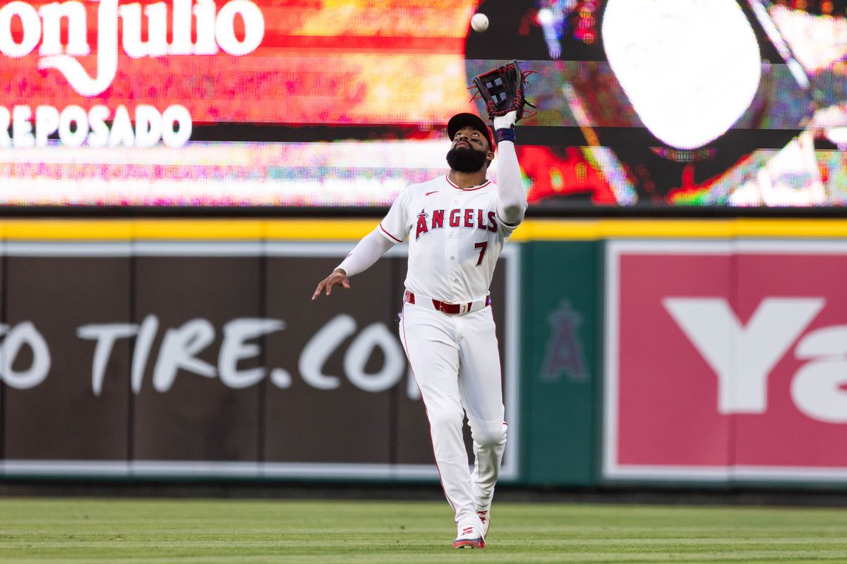 Jo Adell #7 of the Los Angeles Angels catches a fly ball during an MLB game against the Texas Rangers on May 23, 2026 at Angel Stadium in Anaheim, California.