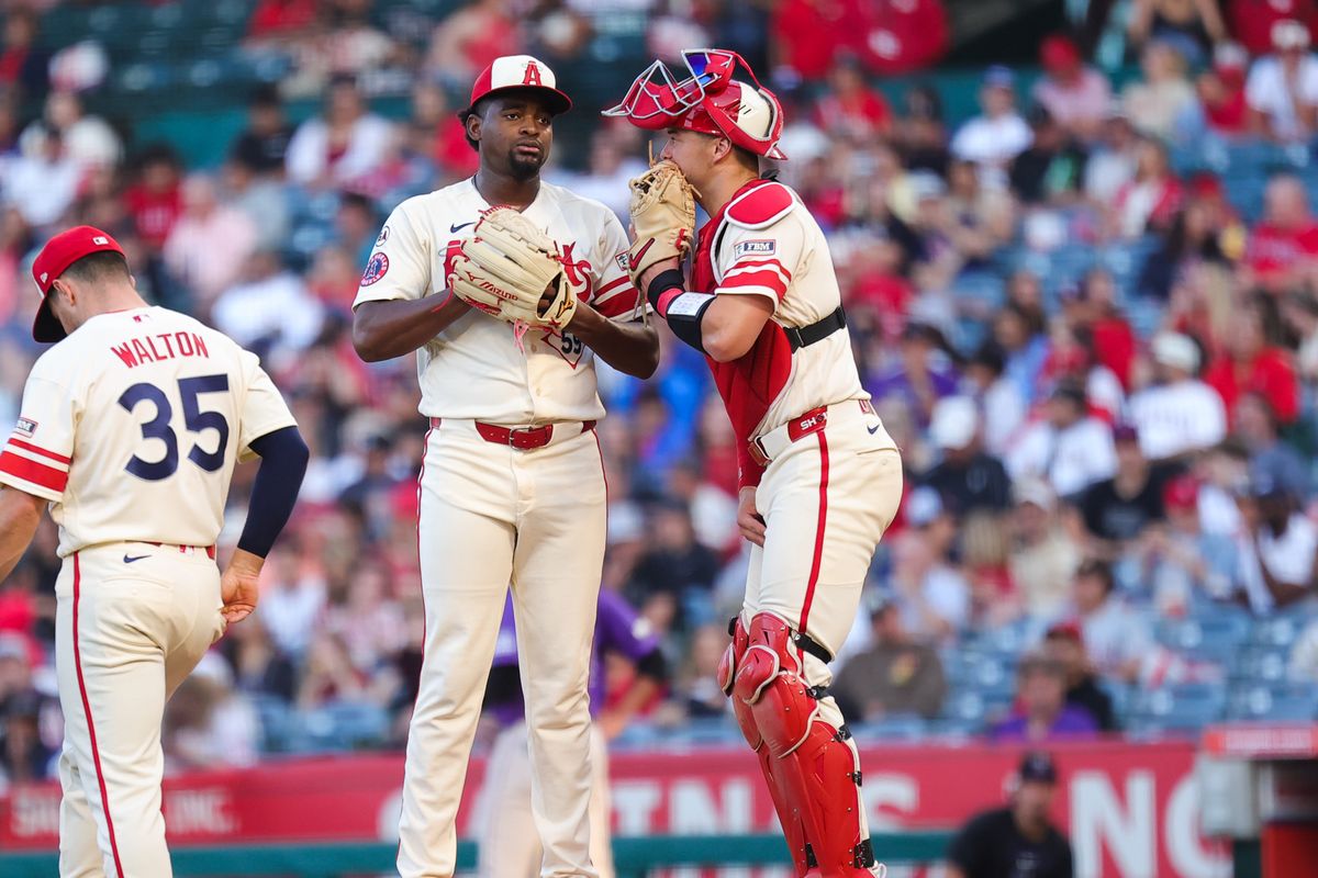Los Angeles Angels pitcher Jose Soriano (59) and catcher Logan O'Hoppe (14) meet on the mound during an MLB game against the Colorado Rockies on June 1, 2026 in Anaheim, CA.