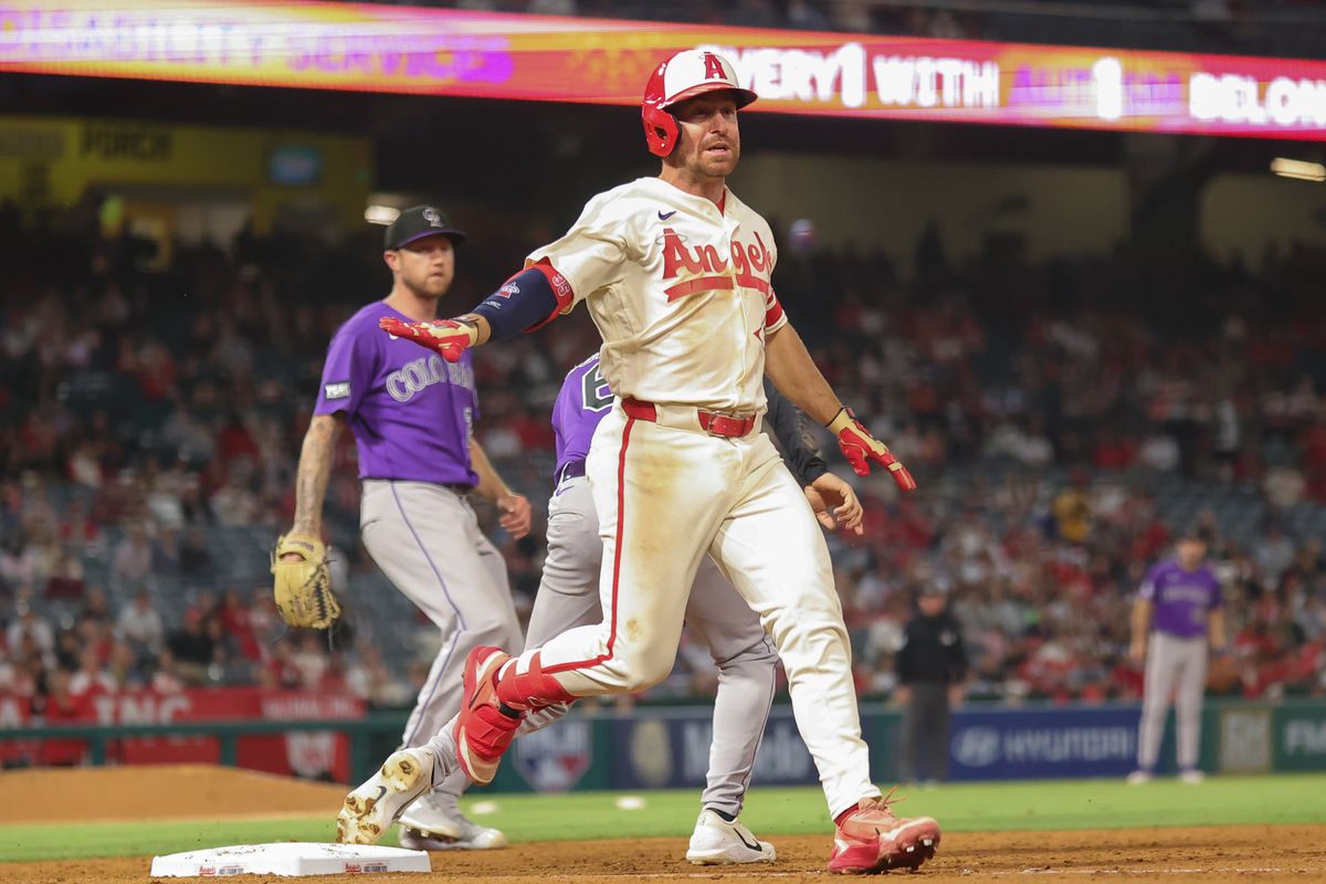 Los Angeles Angels infielder Donovan Walton (35) attempts to make it safe to first during an MLB game against the Colorado Rockies on June 1, 2026 in Anaheim, CA.