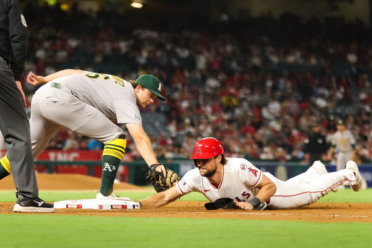 Josh Lowe #3 of the Los Angeles Angels safely slides back to first base during an MLB game against the Las Vegas Athletics on June 27, 2026 in Anaheim, CA.