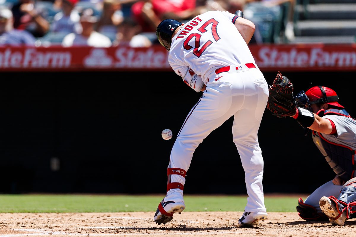 Mike Trout #27 of the Los Angeles Angels is hit with a pitch during the game against the St. Louis Cardinals at Angel Stadium of Anaheim on July 22, 2026 in Anaheim, California. 