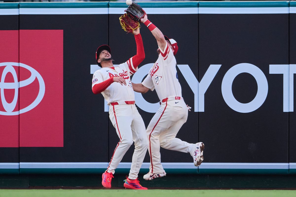 The Los Angeles Angels Mike Trout #27 and Jose Siri #28 collide for an outfield catch during an MLB game against The Milwaukee Brewers on July 31st, 2026 at Angel Stadium in Anaheim, California. The Los Angeles Angels Mike Trout #27 and Jose Siri #28 collide for an outfield catch during an MLB game against The Milwaukee Brewers on July 31st, 2026 at Angel Stadium in Anaheim, California.