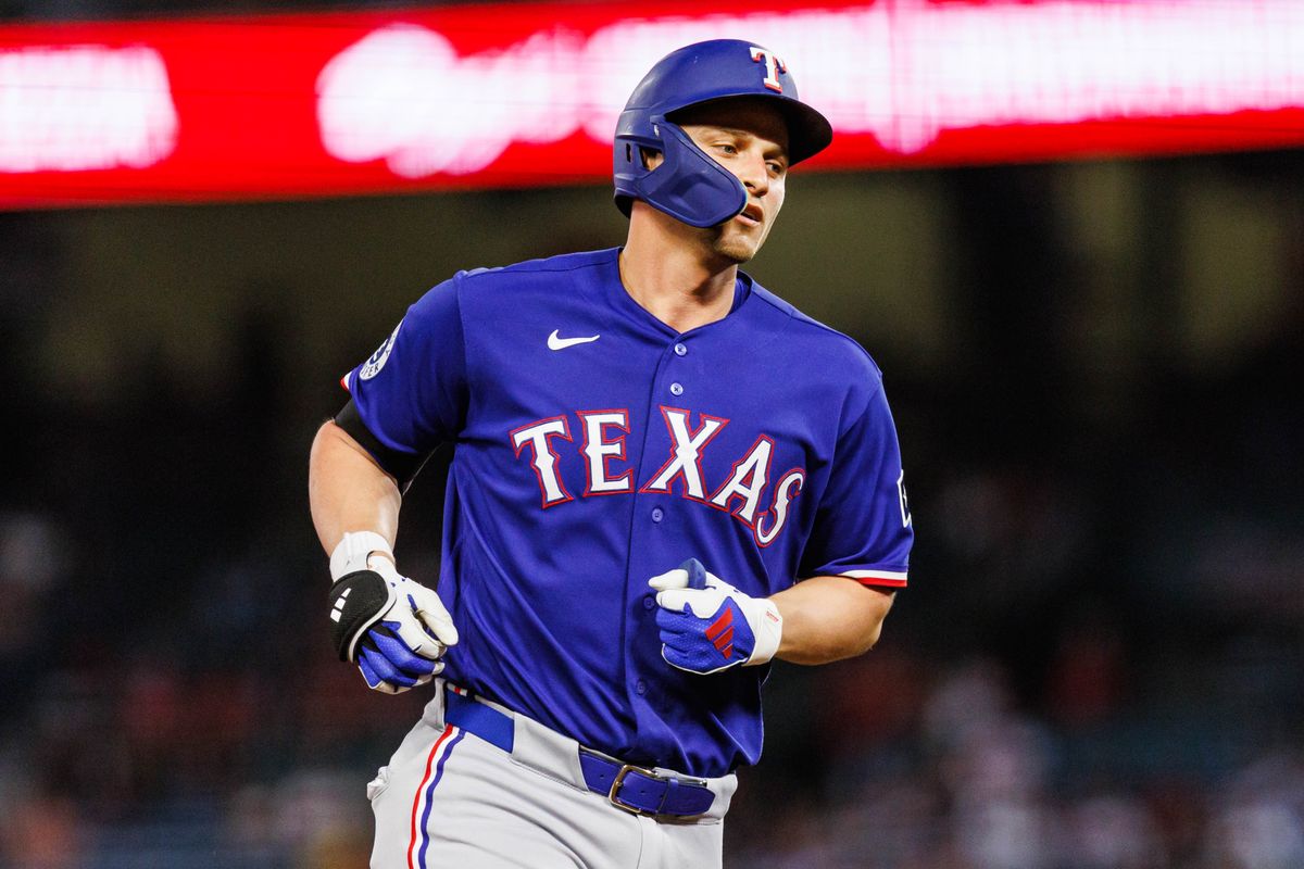 Corey Seager #5 of the Texas Rangers runs the bases after hitting a home run during an MLB game against the Los Angeles Angels on August 12, 2026 at Angel Stadium in Anaheim, California.