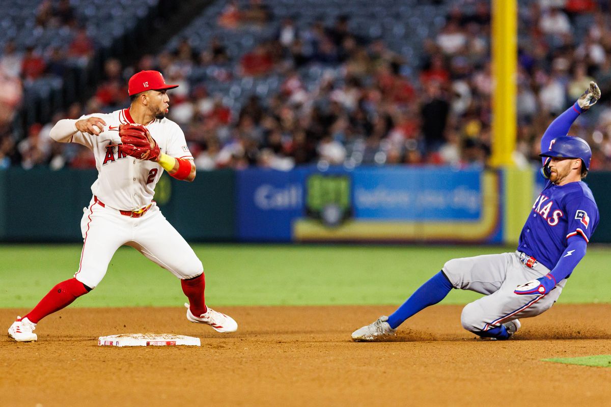 Oswald Peraza #2 of the Los Angeles Angels attempts to complete the double play during an MLB game against the Texas Rangers on August 12, 2026 at Angel Stadium in Anaheim, California.