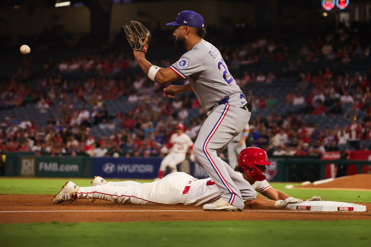 Los Angeles Angels infielder Adam Frazier (20) dives to third base during the MLB game against the Texas Rangers Thursday August 13th, 2026 at Angel Stadium in Anaheim, Calif. Los Angeles Angels infielder Adam Frazier (20) dives to third base during the MLB game against the Texas Rangers Thursday August 13th, 2026 at Angel Stadium in Anaheim, Calif.