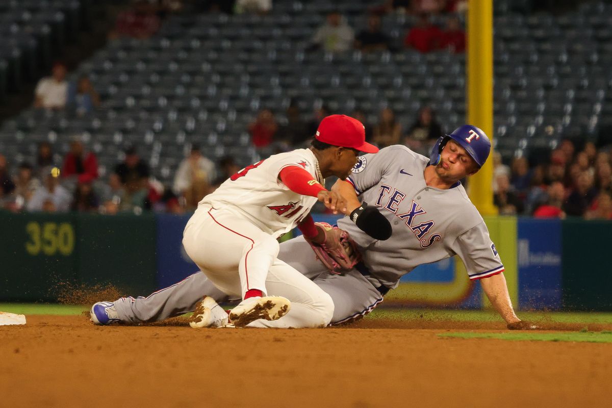 Los Angeles Angels infielder Denzer Guzman (23) tags Texas Rangers infielder Corey Seager (5) during the MLB game Thursday August 13th, 2026 at Angel Stadium in Anaheim, Calif. Los Angeles Angels infielder Denzer Guzman (23) tags Texas Rangers infielder Corey Seager (5) during the MLB game Thursday August 13th, 2026 at Angel Stadium in Anaheim, Calif.