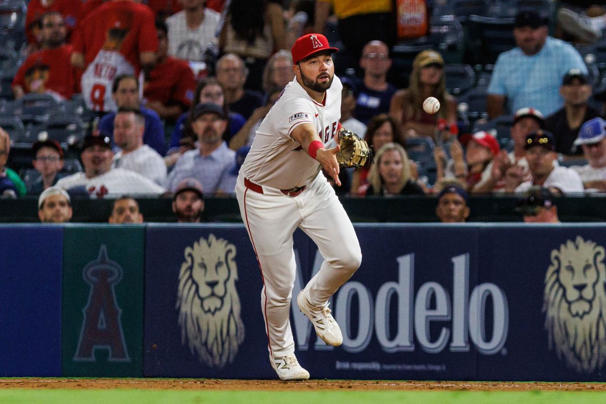 Nolan Schanuel #18 of the Los Angeles Angels tosses the ball during an MLB game against the Kansas City Royals on August 14, 2026 at Angel Stadium in Anaheim, California.