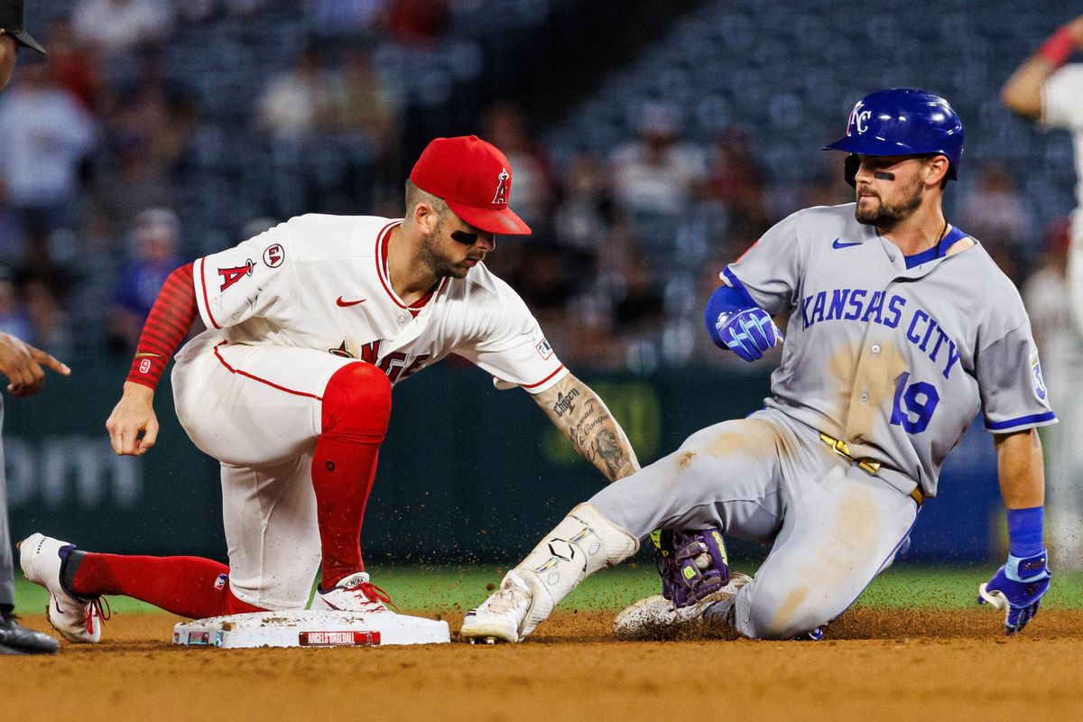 Zach Neto #9 of the Los Angeles Angels tags out Michael Massey #19 of the Kansas City Royals during an MLB game against the Kansas City Royals on August 14, 2026 at Angel Stadium in Anaheim, California.