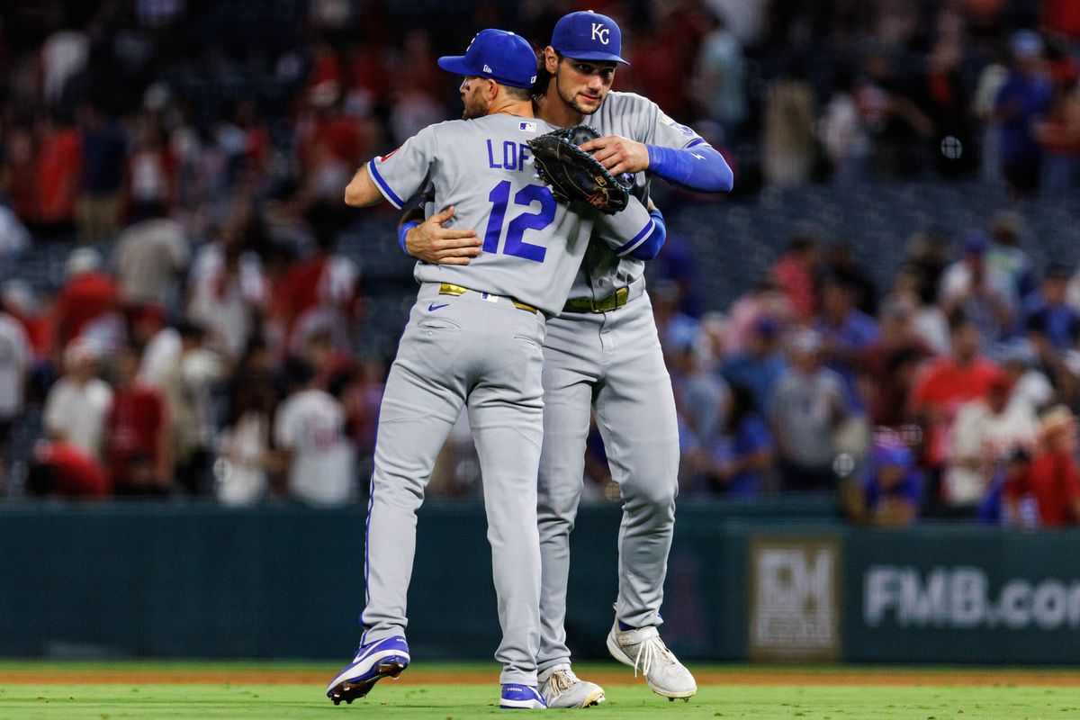 Nick Loftin #12 of the Kansas City Royals celebrates with teammate Jac Caglianone #14 after winning 7-6 during an MLB game against the Los Angeles Angels on August 14, 2026 at Angel Stadium in Anaheim, California.