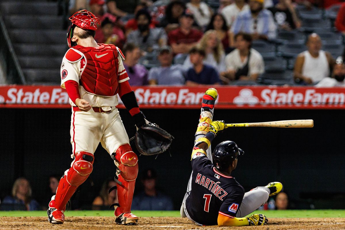 Angel Martinez #1 of the Cleveland Guardians swings and slips during an MLB game against the Los Angeles Angels on August 24, 2026 at Angel Stadium in Anaheim, California.