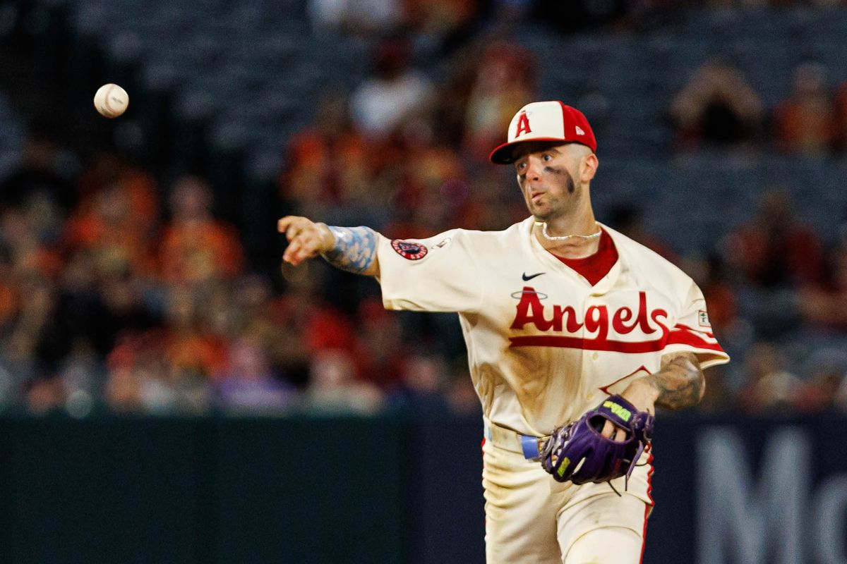 Zach Neto #9 of the Los Angeles Angels throws the ball to first base during an MLB game against the Cleveland Guardians on August 24, 2026 at Angel Stadium in Anaheim, California.