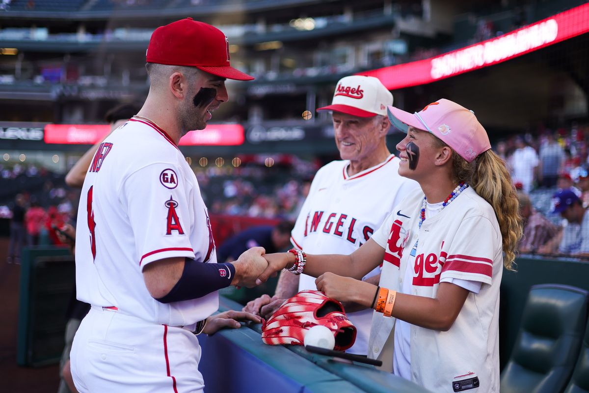 Los Angeles Angels infielder Zach Neto (9) talks to a young fan before the MLB game against the Cleveland Guardians Tuesday August 25th, 2026 at Angel Stadium in Anaheim, Calif. Los Angeles Angels infielder Zach Neto (9) talks to a young fan before the MLB game against the Cleveland Guardians Tuesday August 25th, 2026 at Angel Stadium in Anaheim, Calif.