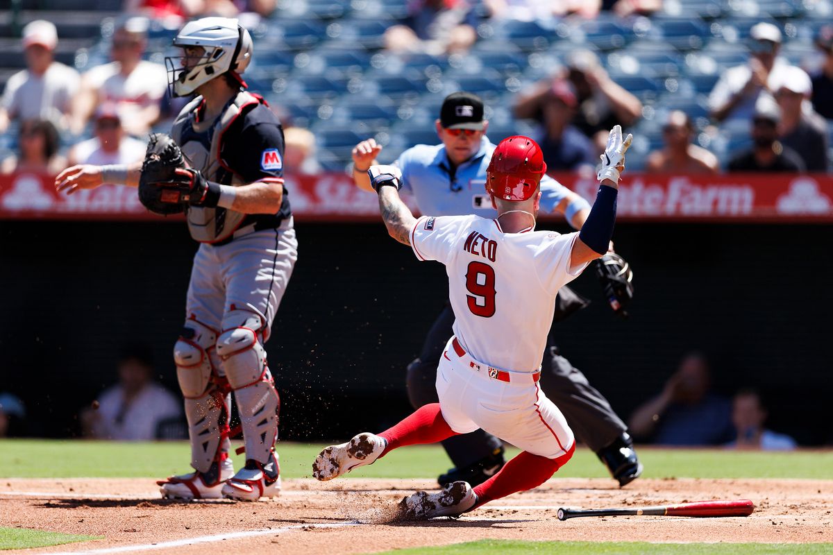 Zach Neto #9 of the Los Angeles Angels slides into home plate during the game against the Cleveland Guardians at Angel Stadium of Anaheim on August 26, 2026 in Anaheim, California. Zach Neto #9 of the Los Angeles Angels slides into home plate during the game against the Cleveland Guardians at Angel Stadium of Anaheim on August 26, 2026 in Anaheim, California.