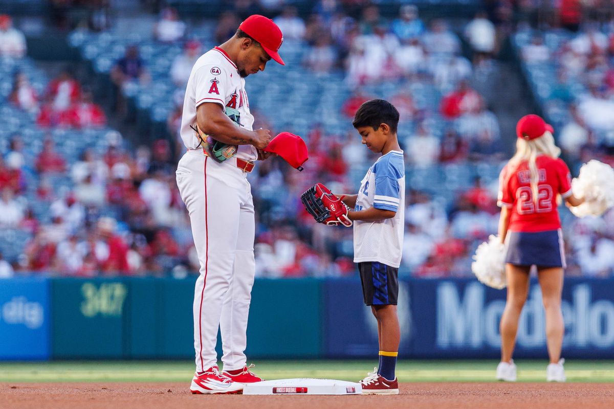 Christian Moore #4 of the Los Angeles Angels signs for a fan before an MLB game against the Philadelphia Phillies on August 28, 2026 at Angel Stadium in Anaheim, California. Christian Moore #4 of the Los Angeles Angels signs for a fan before an MLB game against the Philadelphia Phillies on August 28, 2026 at Angel Stadium in Anaheim, California.