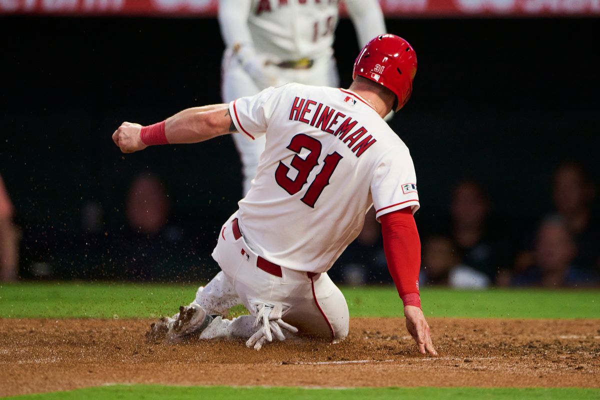 The Los Angeles Angels Tyler Heineman #31 slides into home base during an MLB game against The New York Yankees on August 31st, 2026 at Angel Stadium in Anaheim, California. The Los Angeles Angels Tyler Heineman #31 slides into home base during an MLB game against The New York Yankees on August 31st, 2026 at Angel Stadium in Anaheim, California.