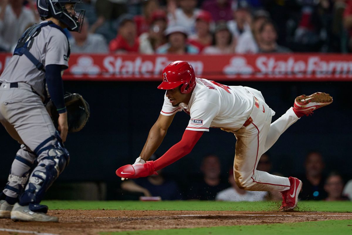 The Los Angeles Angels Christian Moore #4 slides into home base during an MLB game against The New York Yankees on August 31st, 2026 at Angel Stadium in Anaheim, California. The Los Angeles Angels Christian Moore #4 slides into home base during an MLB game against The New York Yankees on August 31st, 2026 at Angel Stadium in Anaheim, California.