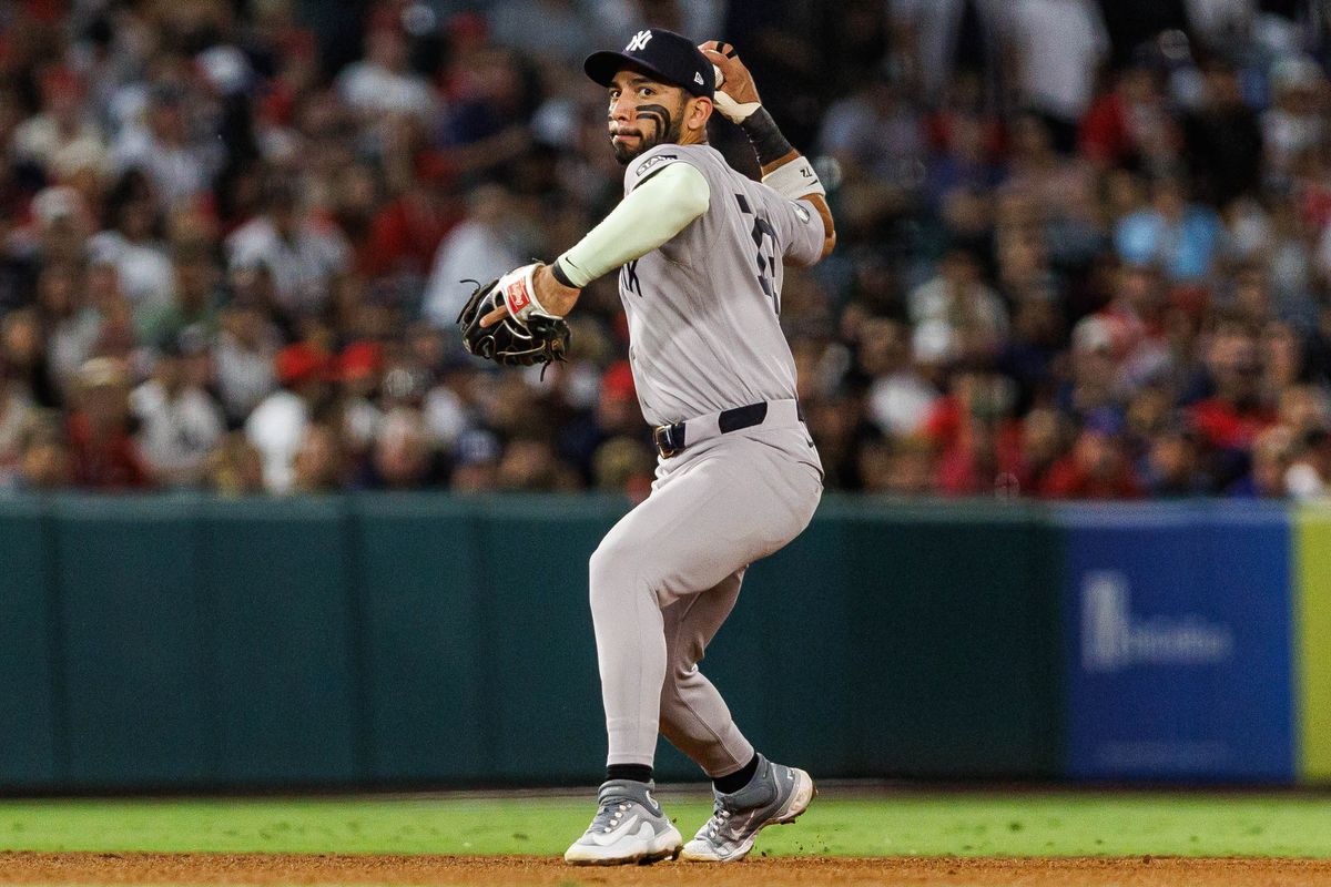 Jose Caballero #72 of the New York Yankees throws the ball to first base during an MLB game against the Los Angeles Angels on September 2, 2026 at Angel Stadium in Anaheim, California.