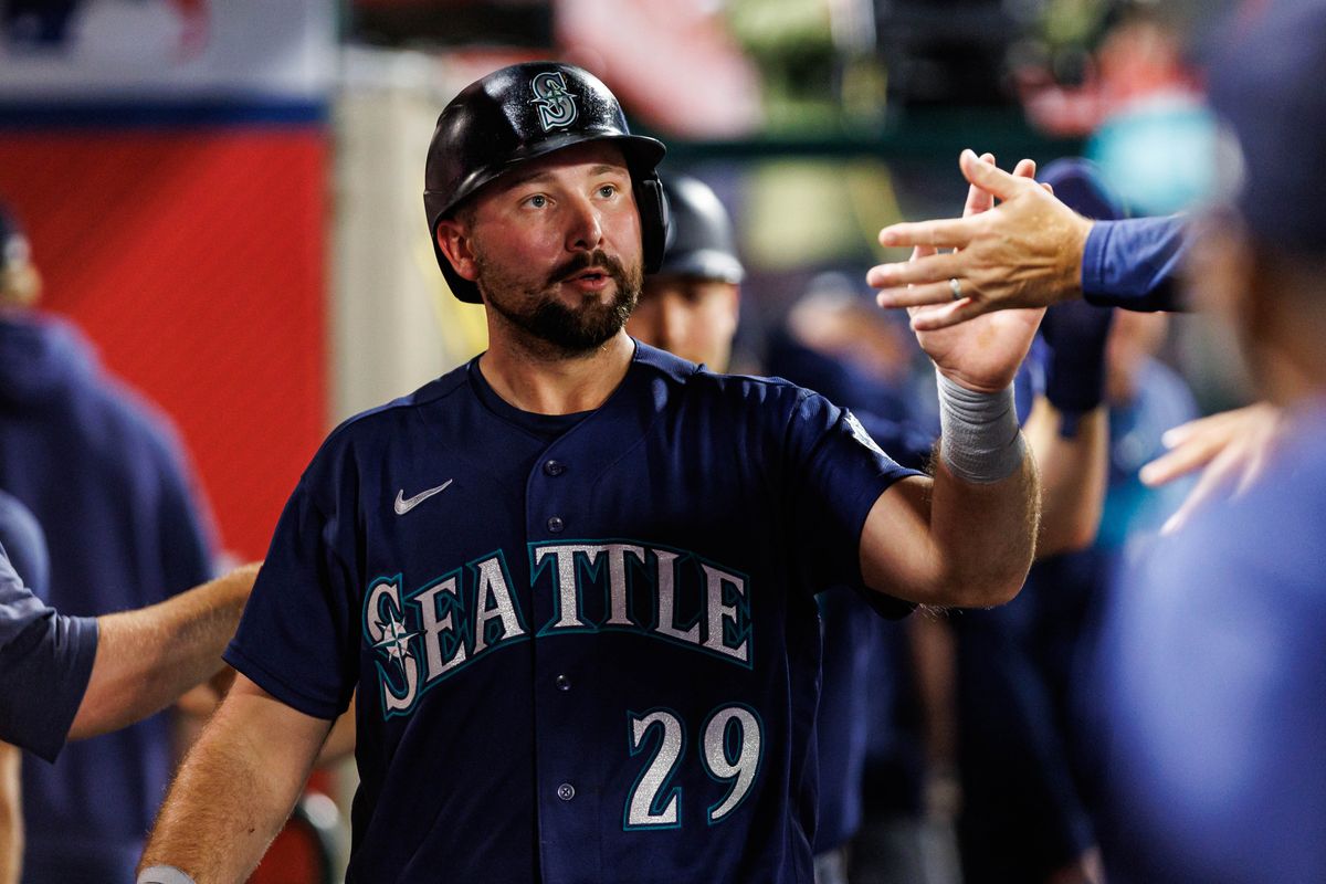 Cal Raleigh #29 of the Seattle Mariners is welcomed back to the dugout after scoring a run during an MLB game against the Los Angeles Angels on September 16, 2026 at Angel Stadium in Anaheim, California. Cal Raleigh #29 of the Seattle Mariners is welcomed back to the dugout after scoring a run during an MLB game against the Los Angeles Angels on September 16, 2026 at Angel Stadium in Anaheim, California.