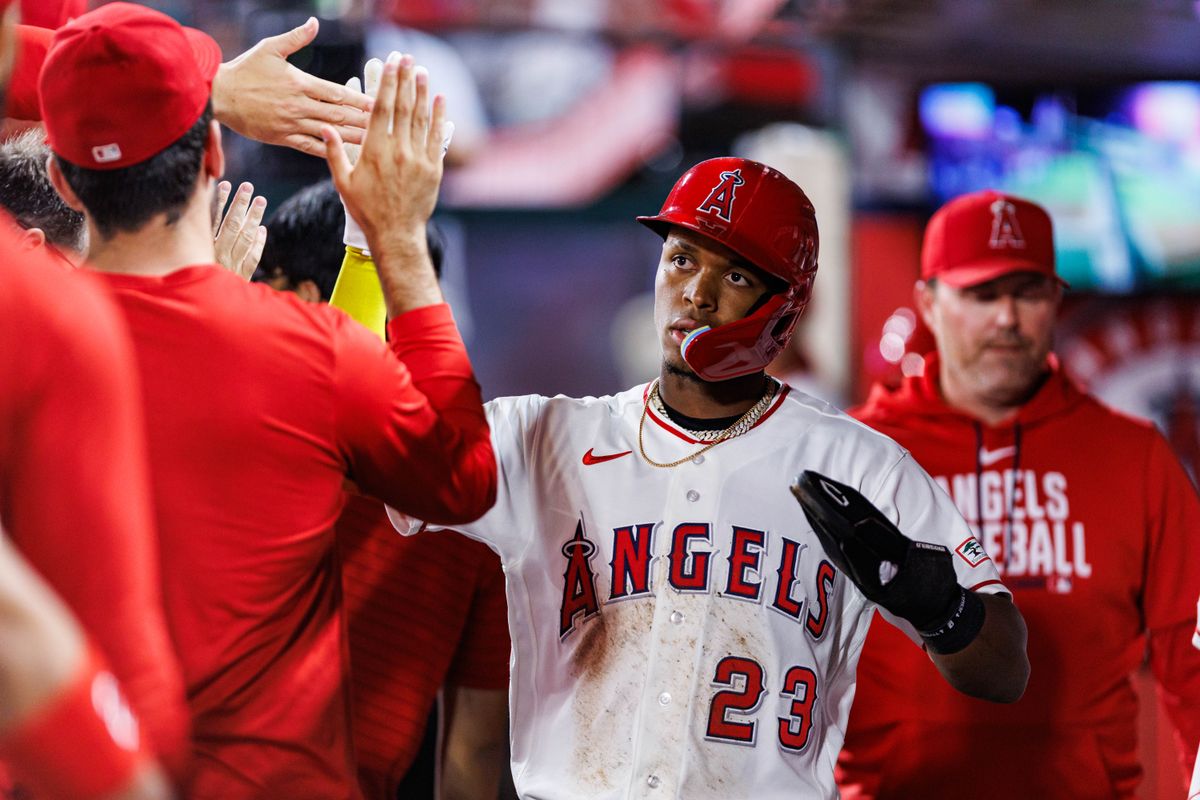 Denzer Guzmán #23 of the Los Angeles Angels is welcomed back after scoring a run during an MLB game against the Seattle Mariners on September 16, 2026 at Angel Stadium in Anaheim, California. Denzer Guzmán #23 of the Los Angeles Angels is welcomed back after scoring a run during an MLB game against the Seattle Mariners on September 16, 2026 at Angel Stadium in Anaheim, California.
