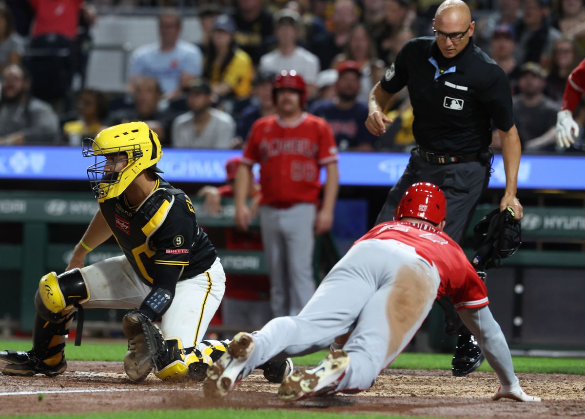 Sep 5, 2026; Pittsburgh, Pennsylvania, USA; Los Angeles Angels center fielder Mike Trout (right) slides past Pittsburgh Pirates catcher Rafael Flores Jr. (43) to score a run during the seventh inning at PNC Park. Mandatory Credit: Charles LeClaire-Imagn Images Sep 5, 2026; Pittsburgh, Pennsylvania, USA; Los Angeles Angels center fielder Mike Trout (right) slides past Pittsburgh Pirates catcher Rafael Flores Jr. (43) to score a run during the seventh inning at PNC Park. Mandatory Credit: Charles LeClaire-Imagn Images