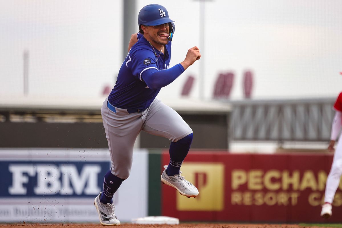 Los Angeles Dodgers second baseman Kike Hernandez (8) runs to second base during a spring training baseball game against the Los Angeles Angels Wednesday March 5th, 2025 at Tempe Diablo Stadium in Tempe, Ariz.