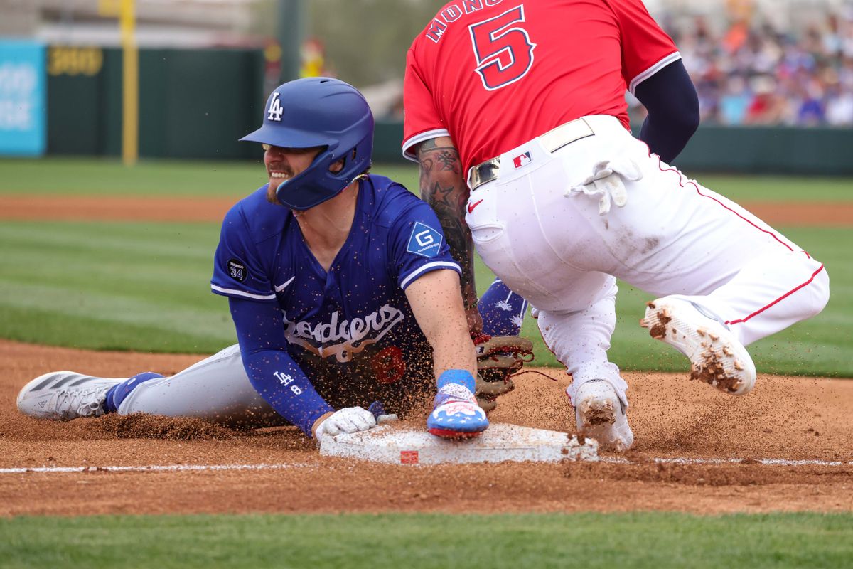 Los Angeles Dodgers second baseman Kike Hernandez (8) slides into second base during a spring training baseball game against the Los Angeles Angels Wednesday March 5th, 2025 at Tempe Diablo Stadium in Tempe, Ariz.