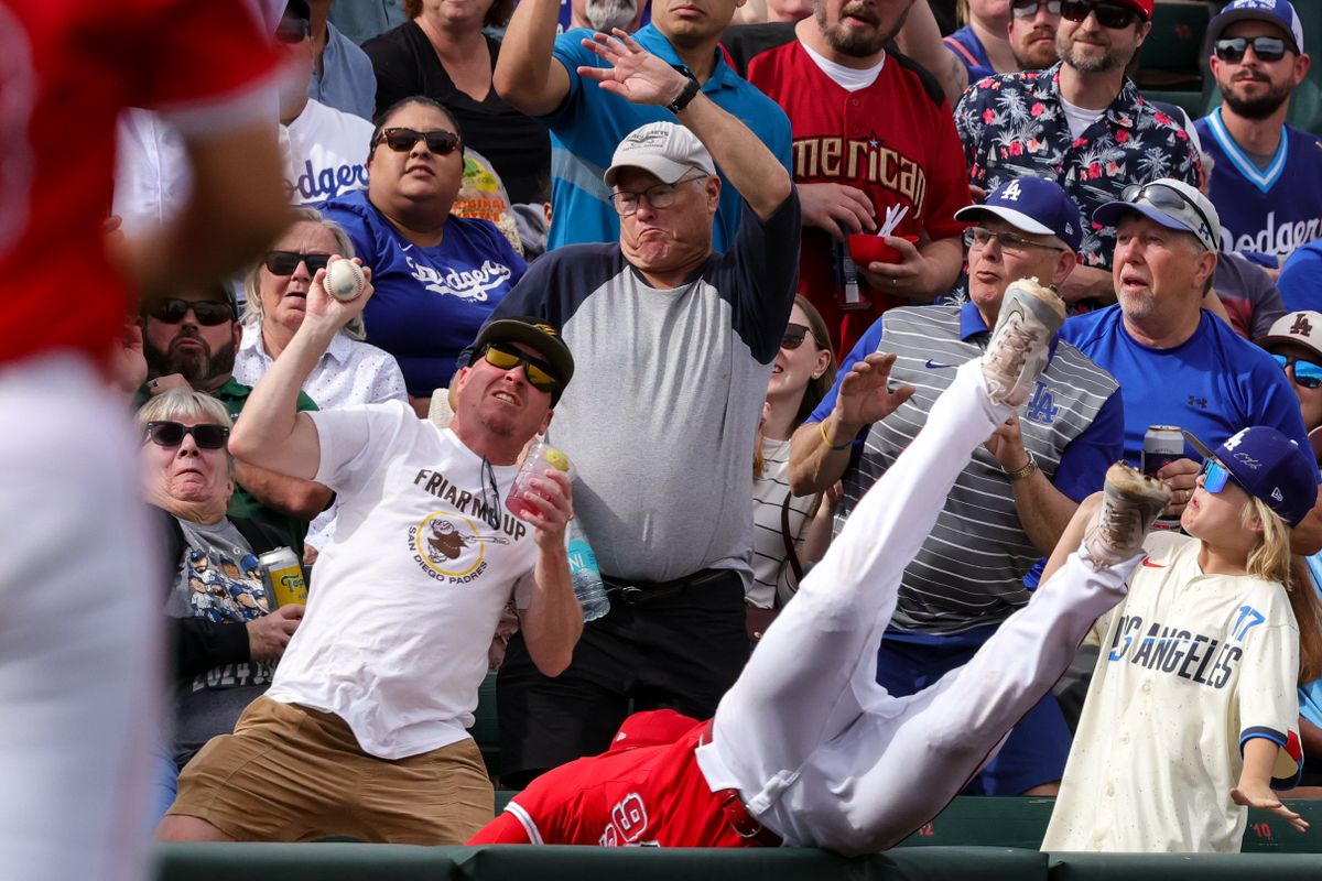 Los Angeles Angels' Cole Fontenelle (76) reaches for a foul ball during a spring training baseball game against the Los Angeles Dodgers Wednesday March 5th, 2025 at Tempe Diablo Stadium in Tempe, Ariz.