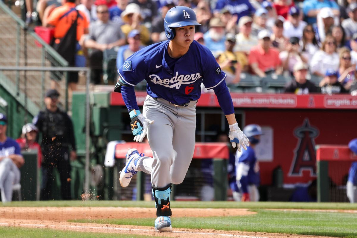 Los Angeles Dodgers' Hyeseong Kim (6) runs to first base during a spring training baseball game against the Los Angeles Angels Wednesday March 5th, 2025 at Tempe Diablo Stadium in Tempe, Ariz.