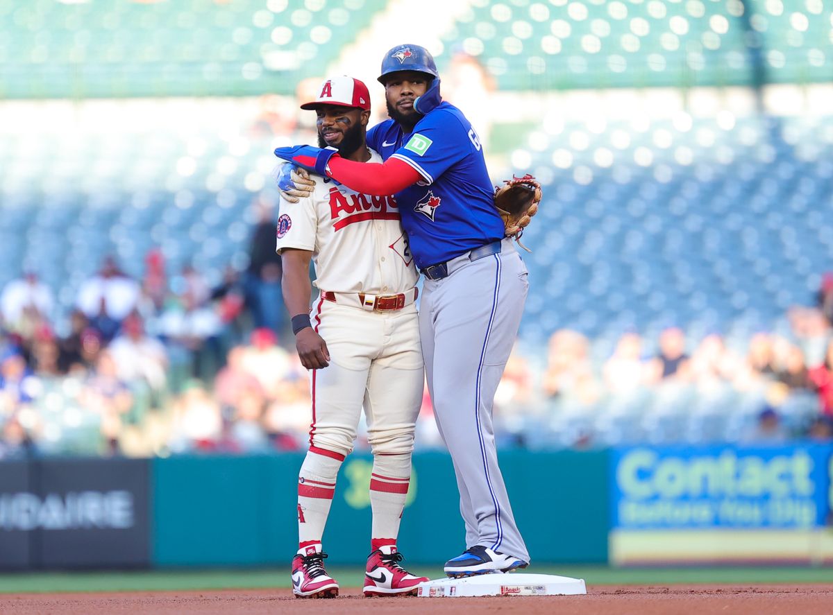 Toronto Blue Jays infielder #27 Vladmir Guerrero Jr. hugs outfielder #12 Jorge Soler of the Los Angeles Angels on May 7, 2024 in Anaheim, CA.