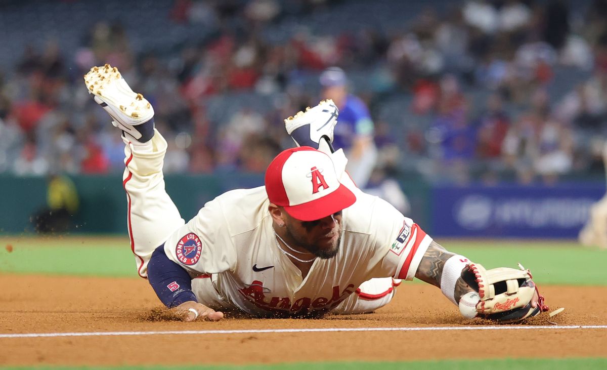 Los Angeles Angels infielder #5 Yoan Moncada makes a diving catch against the Toronto Blue Jays on May 7, 2024 in Anaheim, CA.