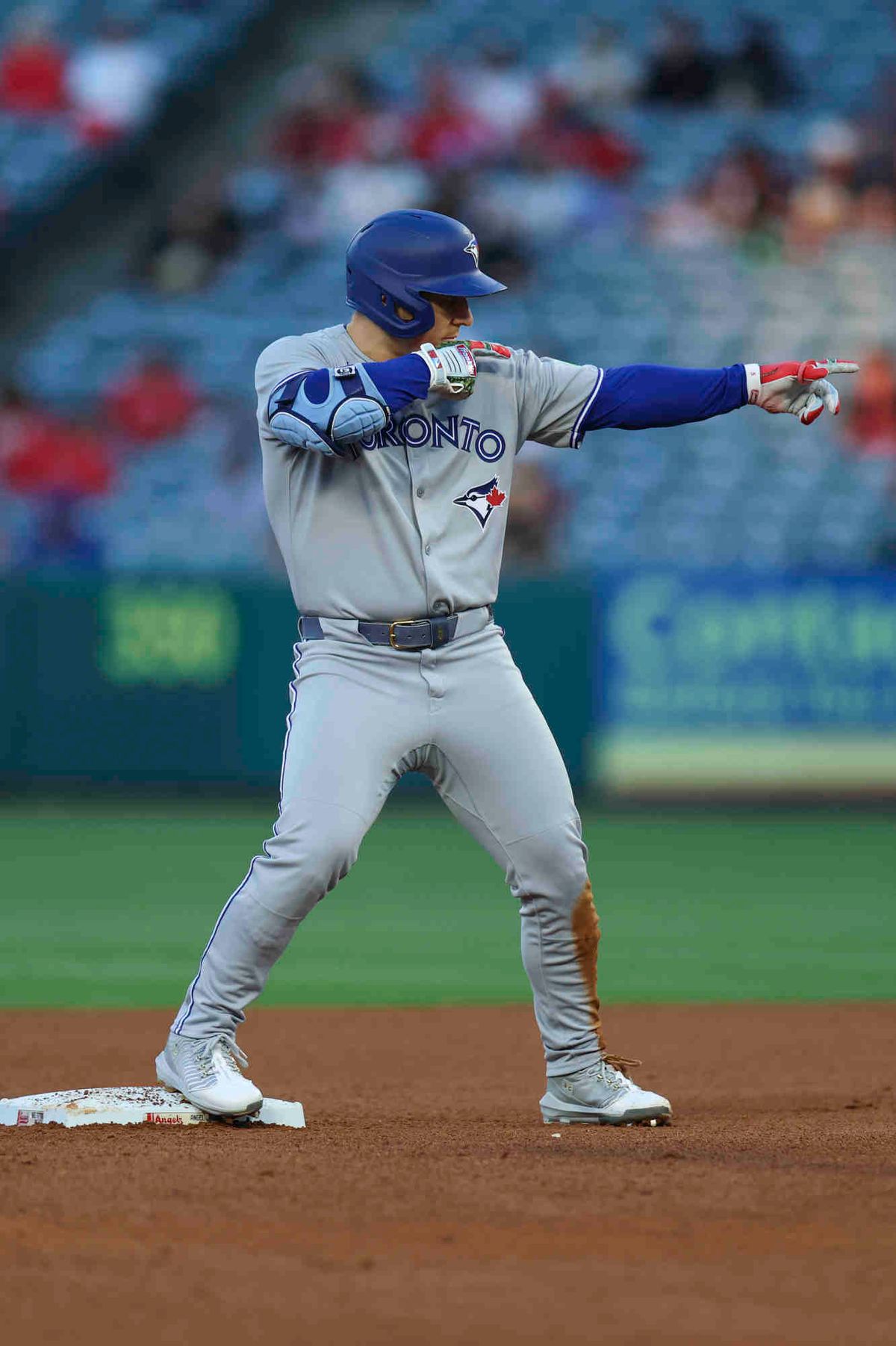 Daulton Varsho #5 of the Toronto Blue Jays celebrates an RBI double in the third inning during a game against the Los Angeles Angels at Angel Stadium of Anaheim on Thursday, May 8, 2025 in Anaheim, California.