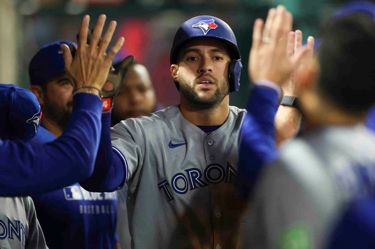 George Springer #4 of the Toronto Blue Jays celebrates scoring a run in the fourth inning during a game against the Los Angeles Angels at Angel Stadium of Anaheim on Thursday, May 8, 2025 in Anaheim, California.