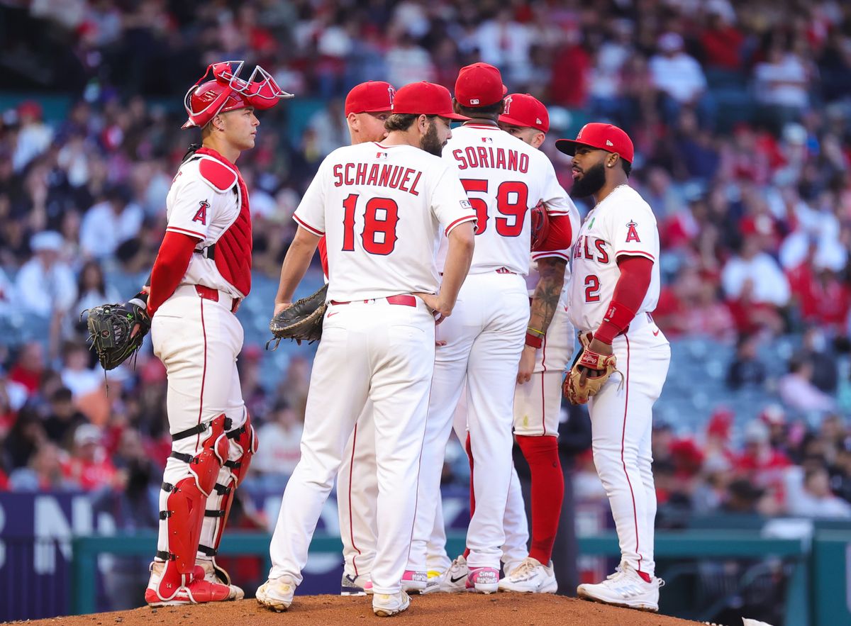 Los Angeles Angels players meet on the mound during an MLB game agains the Florida Marlins on May 24, 2025 in Anaheim, CA.