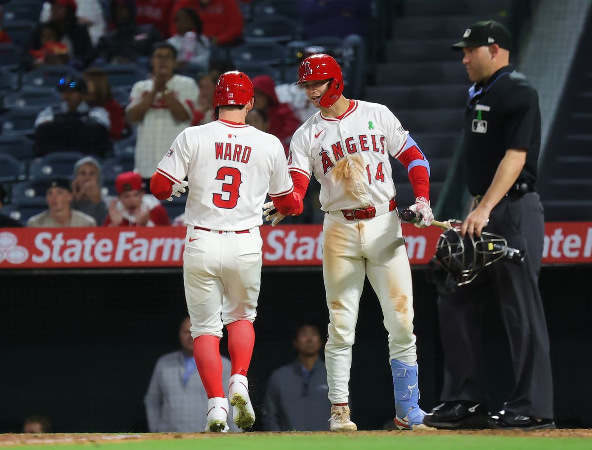 Los Angeles Angels outfielder #3 Taylor Ward celebrates at home plate with catcher #14 Logan O'Hoppe during an MLB game against the Florida Marlins on May 24, 2025 in Anaheim, CA.