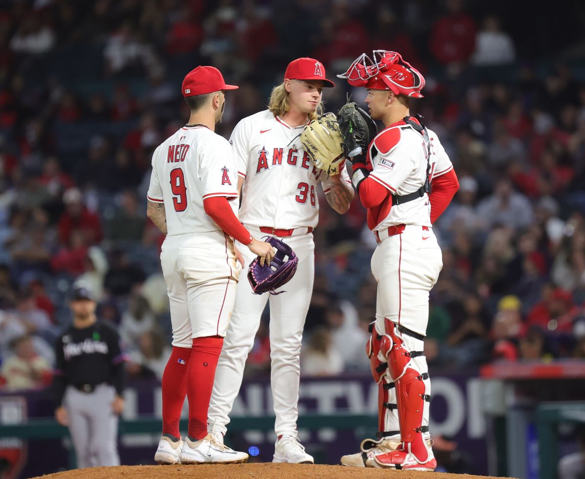 Los Angeles Angels players meet with relief pitcher #36 Caden Dana on the mound during an MLB game agains the Florida Marlins on May 24, 2025 in Anaheim, CA.