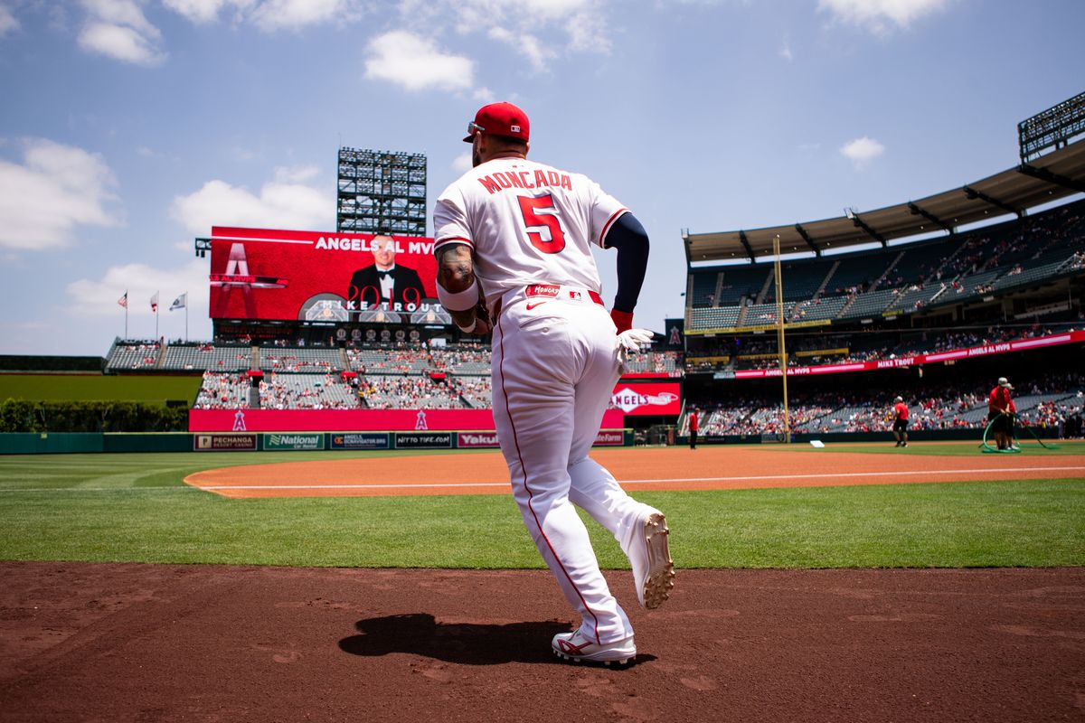 Los Angeles Angels third base Yoán Moncada (5) runs out of dugout during the game against the Miami Marlins on Sunday, May 25, 2025, at Angel Stadium in Anaheim, CA.