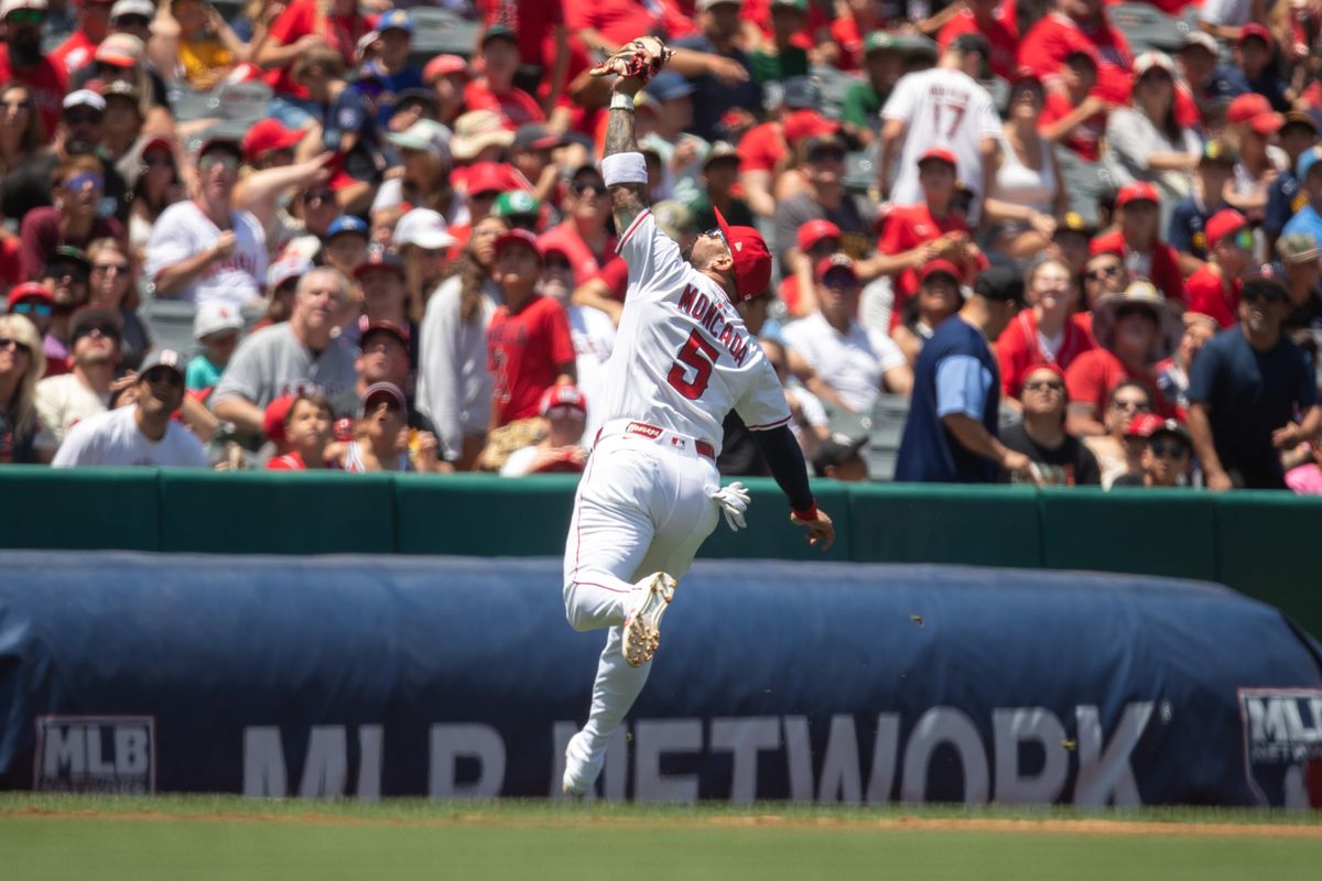 Los Angeles Angels third base Yoán Moncada (5) runs outfield to catch ball during the game against the Miami Marlins on Sunday, May 25, 2025, at Angel Stadium in Anaheim, CA.