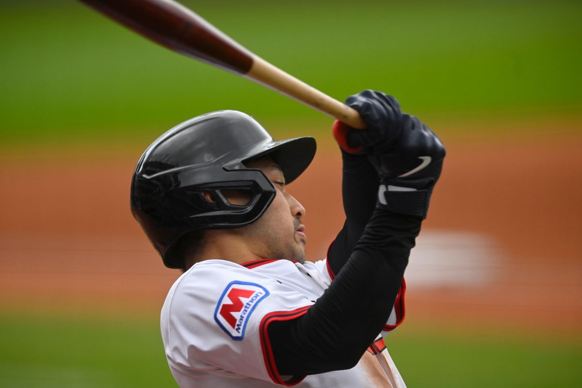 Cleveland Guardians left fielder Steven Kwan (38) swings while on deck in the third inning against the Los Angeles Angels at Progressive Field.