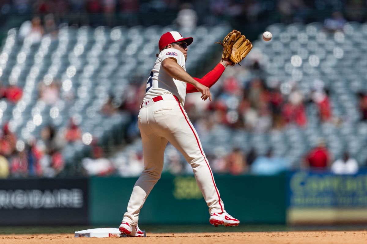 Los Angeles Angels infielder Scott Kingery (13) catches a ball near second base during the game against the Seattle Mariners on Saturday, June 7, 2025, at Angel Stadium in Anaheim, CA.