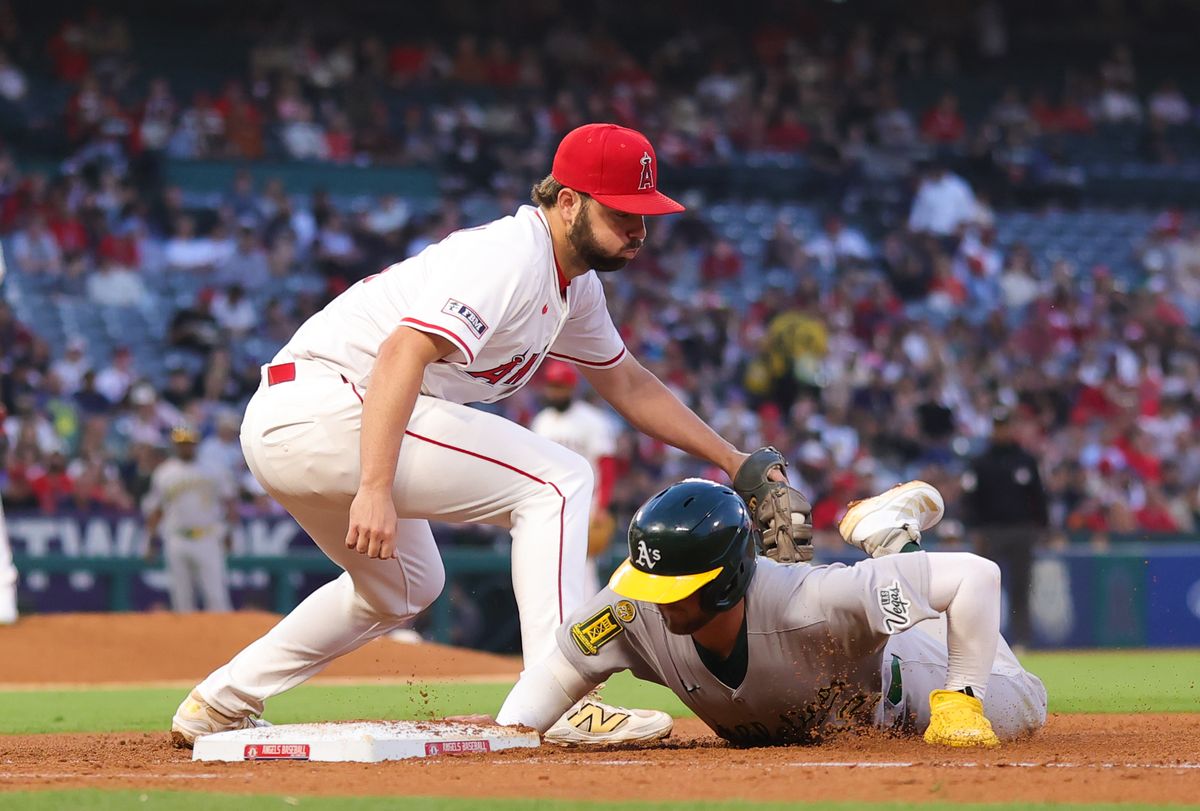 Los Angeles Angels infielder #18 Nolan Schanuel attempts a tag at first base during an MLB game against the Las Vegas Athletics on June 10, 2025 in Anaheim, CA. in Anaheim, CA.
