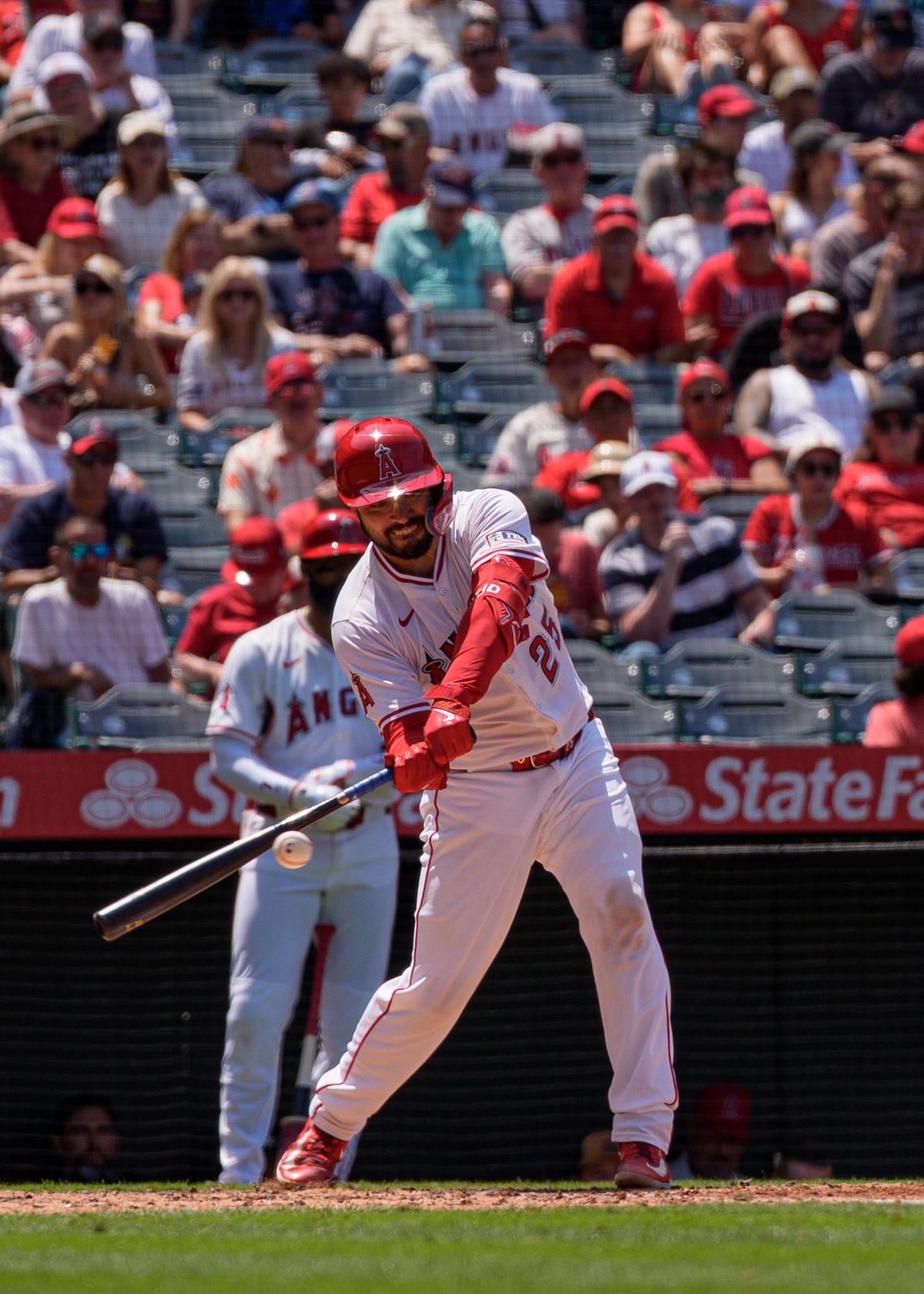Los Angeles Angels' Catcher, Travis d'Arnaud 25, hits a foul ball during an MLB baseball game against the Athletics on June 11, 2025 in Anaheim, CA.