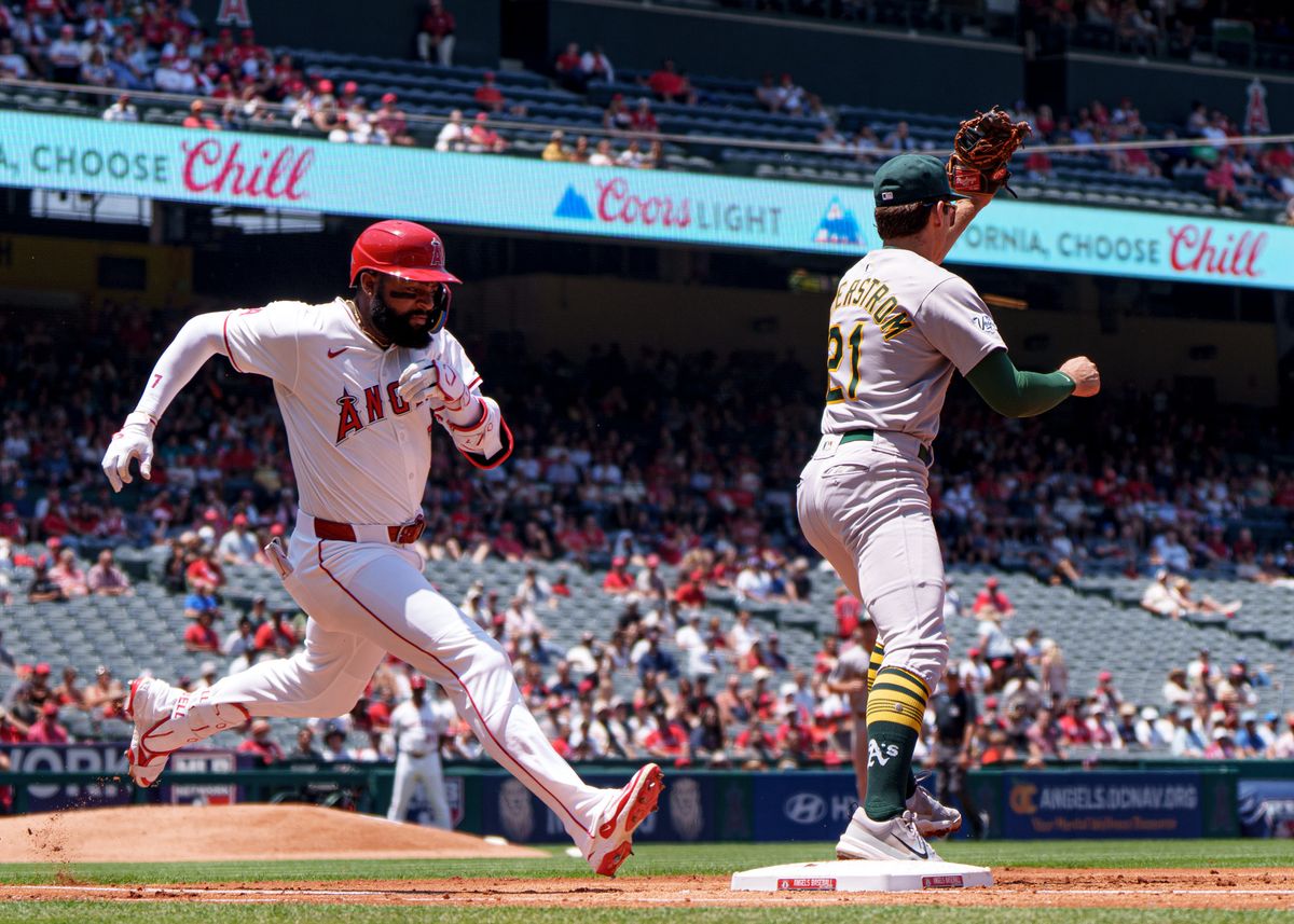 Los Angeles Angels' Outfielder, Jo Adell 7, narrowly makes it safely to first base during an MLB baseball game against the Athletics on June 11, 2025 in Anaheim, CA.