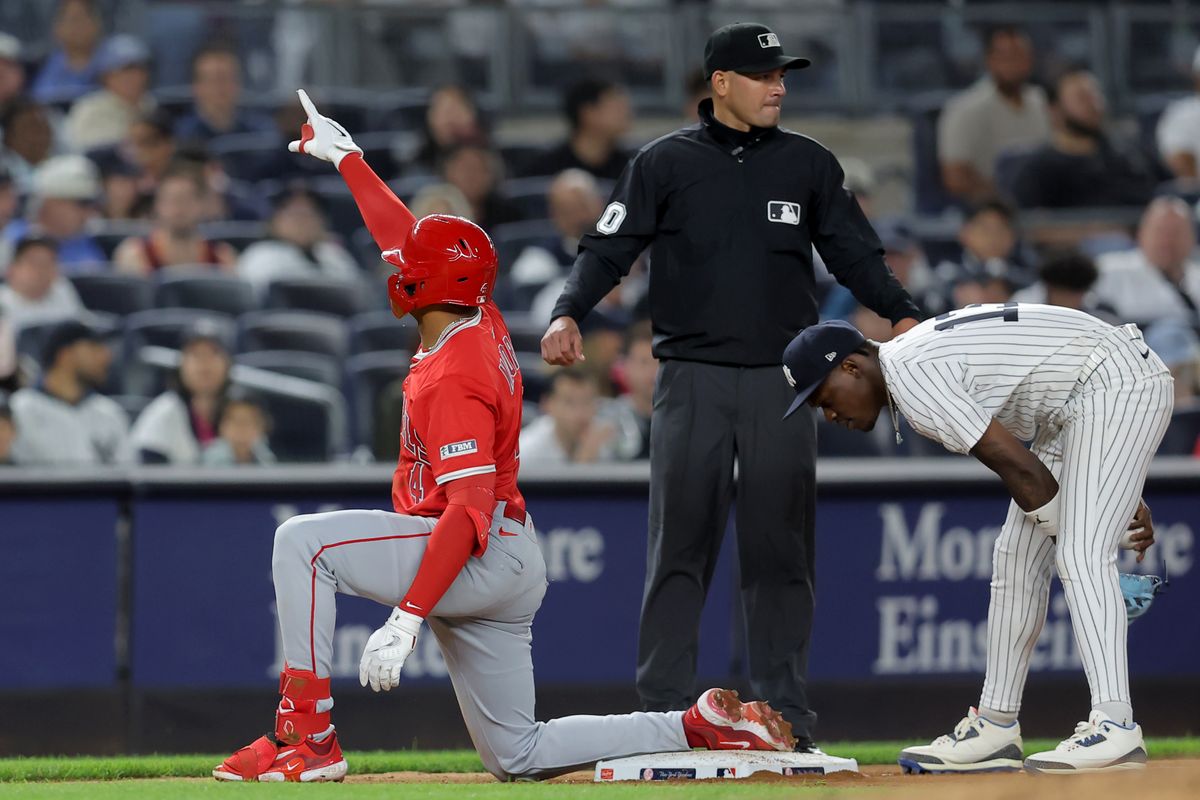 Los Angeles Angels second baseman Christian Moore (4) reacts after hitting a triple against the New York Yankees during the eighth inning at Yankee Stadium