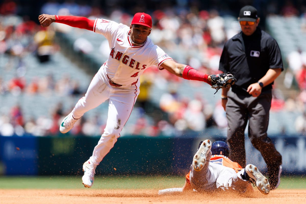 Christian Moore #4 of the Los Angeles Angels catches the ball at second base during the game against the Houston Astros at Angel Stadium of Anaheim on June 22, 2025 in Anaheim, California.