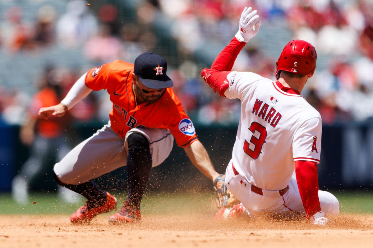 Taylor Ward #3 of the Los Angeles Angels slides into second base during the game against the Houston Astros at Angel Stadium of Anaheim on June 22, 2025 in Anaheim, California.