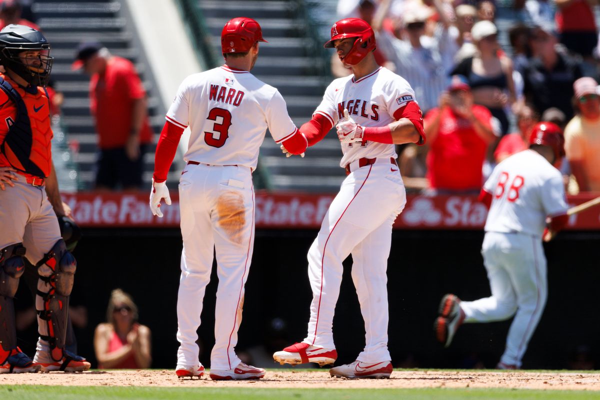 Logan O’Hoppe #14 of the Los Angeles Angels celebrates a home run with Taylor Ward #3 of the Los Angeles Angels during the game against the Houston Astros at Angel Stadium of Anaheim on June 22, 2025 in Anaheim, California. 