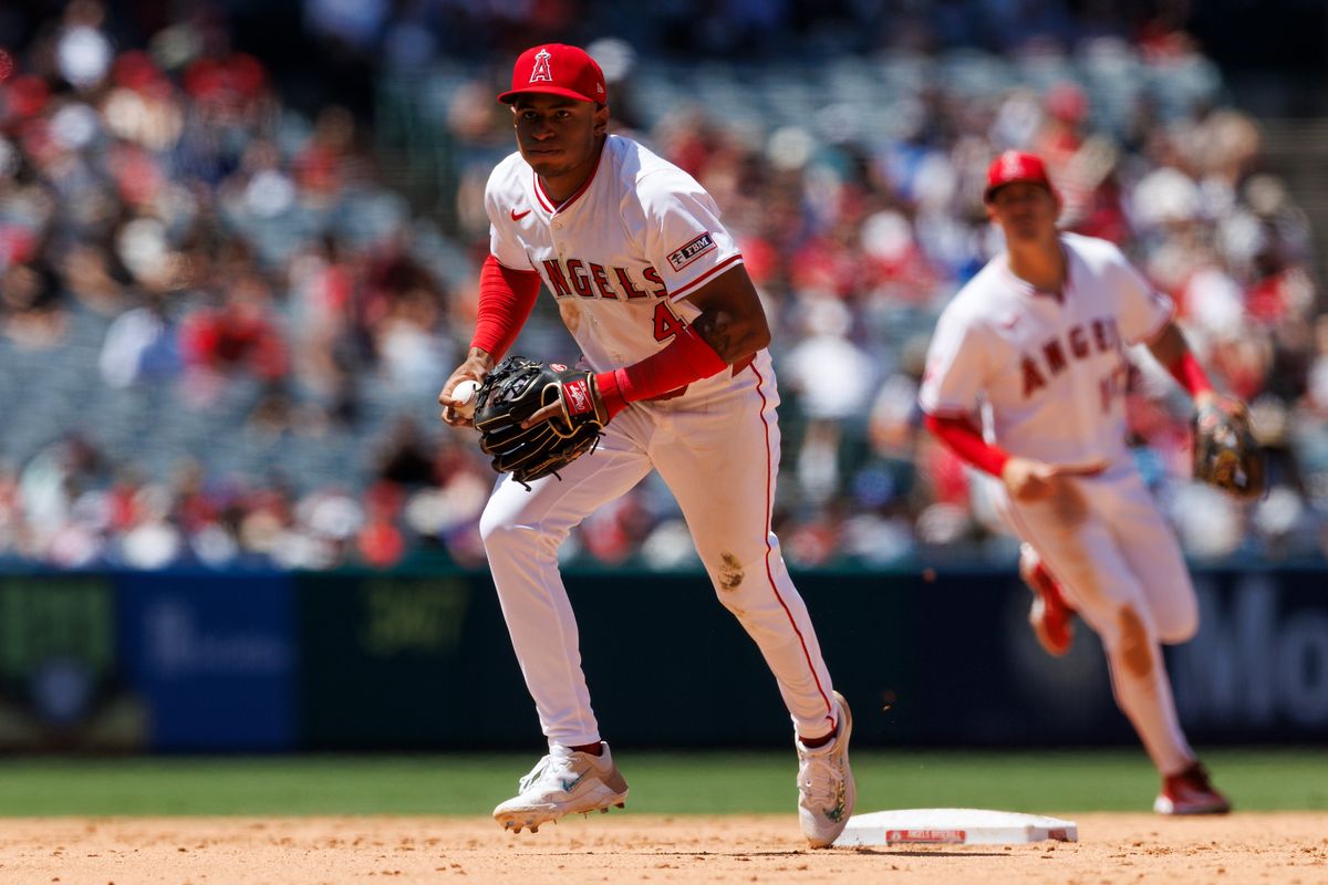 Christian Moore #4 of the Los Angeles Angels runs down Jose Altuve #27 of the Houston Astros during the game at Angel Stadium of Anaheim on June 22, 2025 in Anaheim, California. 