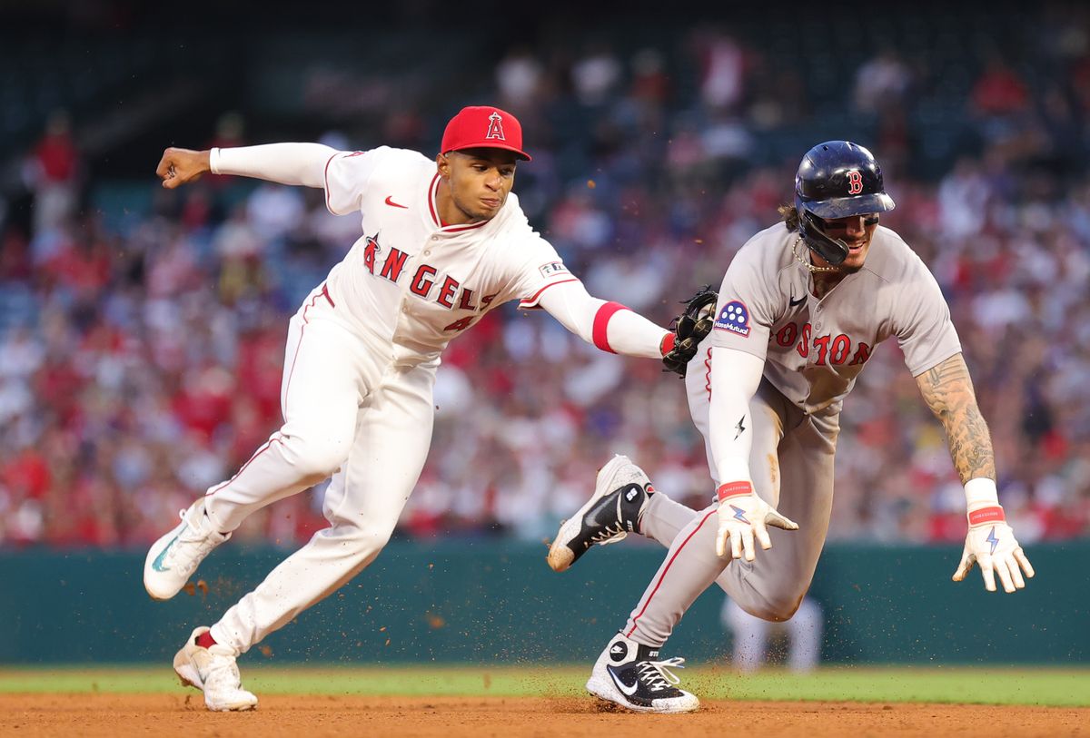 Los Angeles Angels infielder #4 Christian Moore tags out Boston Red Sox outfielder #16 Jarren Duran during an MLB game on June 23, 2025 in Anaheim, CA.