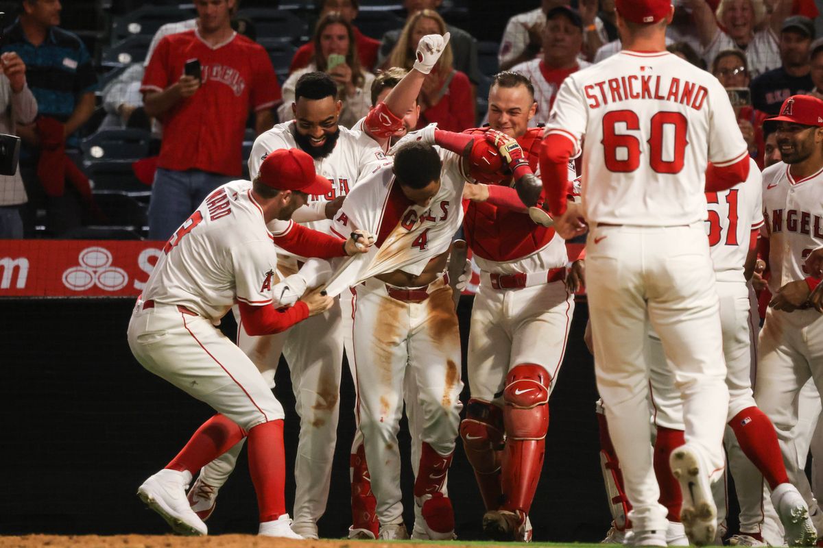 Los Angeles Angels infielder Christian Moore (4) celebrates with teammates after hitting a walk-off during the MLB game against the Boston Red Sox Tuesday June 24th, 2025 at Angel's Stadium in Anaheim, Calif. Los Angeles Angels infielder Christian Moore (4) celebrates with teammates after hitting a walk-off during the MLB game against the Boston Red Sox Tuesday June 24th, 2025 at Angel's Stadium in Anaheim, Calif.