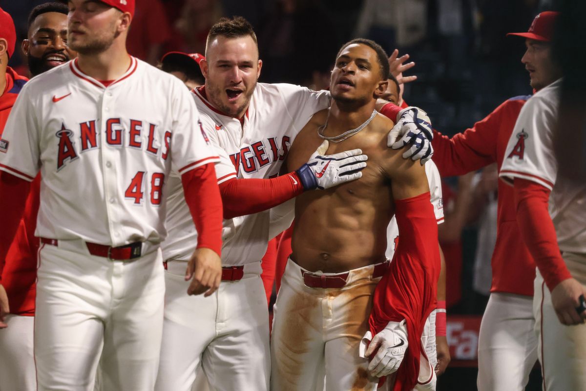 Los Angeles Angels infielder Christian Moore (4) celebrates with teammate Mike Trout (27) after hitting a walk-off during the MLB game against the Boston Red Sox Tuesday June 24th, 2025 at Angel's Stadium in Anaheim, Calif. Los Angeles Angels infielder Christian Moore (4) celebrates with teammate Mike Trout (27) after hitting a walk-off during the MLB game against the Boston Red Sox Tuesday June 24th, 2025 at Angel's Stadium in Anaheim, Calif.